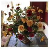Large floral centerpiece in heavy plaster urn