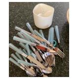 Plastic handled silverware and caddy
