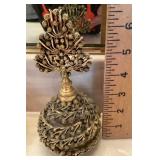 Filigree covered perfume bottle