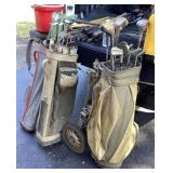 Large lot of golf clubs, bags, balls