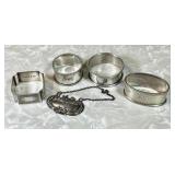 4 sterling silver napkin rings & decanter tag