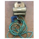 Air compressor with hose