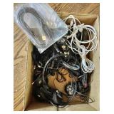 Box with charging cords, headphones, etc.