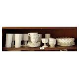 Top shelf of Westmoreland milk glass