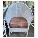 White wicker chair with cushion