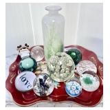 Tray filled with art glass paperweights