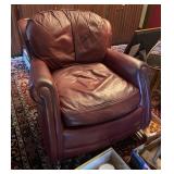 Burgundy leather barrel-style chair