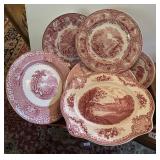 Stack of antique red transferware dishes