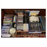 Large group of CDs, DVDs, cassette tapes