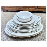 Huge stack of ironstone platters and bowls