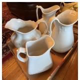 4 ironstone pitchers