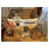 Box with mini oil lamps and vases