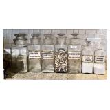 7 glass canister jars with ground glass stoppers
