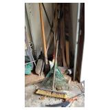Group of long handle tools in garage