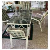 60" glass top patio table and 4 chairs