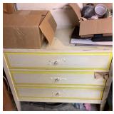 Small chest of drawers and some plumbing supplies