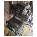 Small air compressor on stand