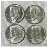 Four 1964 Kennedy half dollars