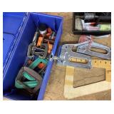 Staplers and C-clamps in plastic tool box
