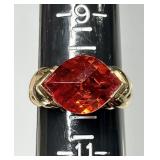 Gold over sterling ring with faceted red stone