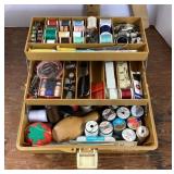 Fishing tackle box filled with sewing notions
