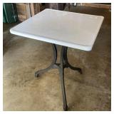 Enameled cast iron table with cast iron base