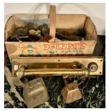 Peach crate with old door knobs, handles,