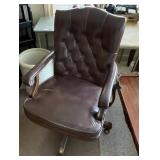Executive office chair on casters,