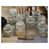 10 old canister jars with ground stoppers