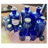 Flat with cobalt blue apothecary jars