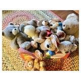 Large flat of plush animals and toys