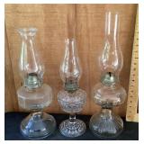 3 glass oil lamps