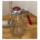 Vintage syrup pitcher with red Bakelite handle