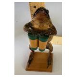 Taxidermy toad playing the bongos
