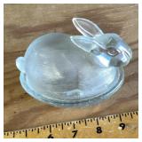 Glass rabbit on basket