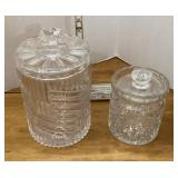 2 heavy glass vanity jars