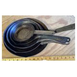 Group of pressed steel skillets