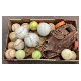 Baseball gloves and assorted balls