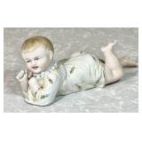Antique bisque piano baby figure