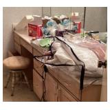 Contents of bathroom with ball and claw foot stool