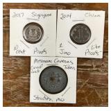 2 Asian coins and 1 Meramec Caverns token