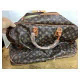 Luggage marked Louis Vuitton