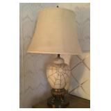 Table lamp with spiderweb overlay