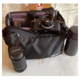 Canon AE-1 camera with bag and accessories