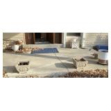 Planters and plant stands on front porch