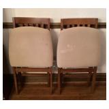Pair of wood folding chairs with upholstered seats