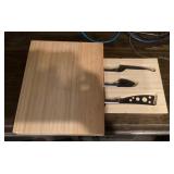 Cutting board with knives in storage drawer