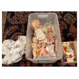 Tote of dolls and toys