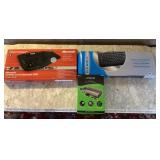 2 computer keyboards and a battery charger