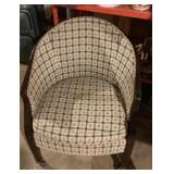 Upholstered chair on casters